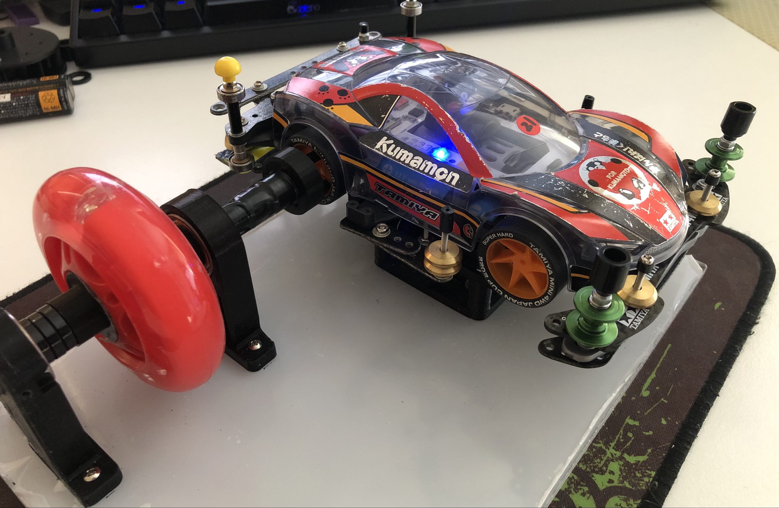 Picture of our Kumamon AI Mini 4WD Mark 8L car on an inertia dyno test